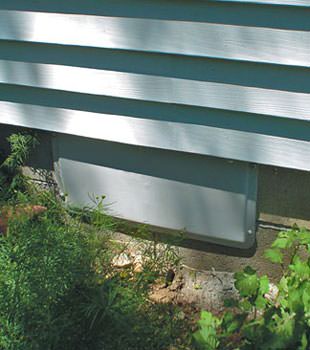 A gray crawl space vent cover in St. Paul