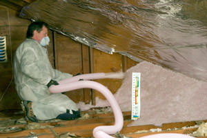 Fiberglass Insulation being used to add energy efficiency to an attic in Maple Grove
