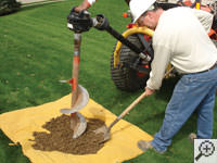 Auguring a hole in the earth for a foundation repair in Bemidji