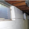 A foundation showing severe inward buckling along the windows in a Hibbing home.