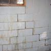 A cracked foundation wall near a window in a Hibbing home