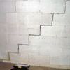 A diagonal stair step crack along the foundation wall of a Minnetonka home
