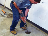 Coring the concrete of a concrete slab floor in Hibbing