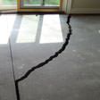a huge crack in a concrete slab floor in Maple Grove