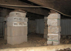 crawl space repairs done with concrete cinder blocks and wood shims in a Eau Claire home