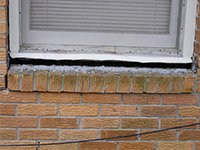 A window sill cracking and separating from the foundation wall in a Minnetonka home.