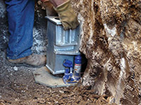 Securing a foundation footing bracket for a foundation repair system in Eau Claire.