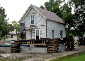 A severely damaged home foundation that is undergoing replacement in Eau Claire.