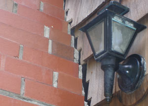 A tilting chimney in Bemidji showing serious foundation damage.