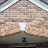 Major tuckpointing on a home archway over a door, with tuckpointing several inches wide that has failed on a Duluth home