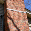 A tilting chimney on a Bemidji home with a leaning, tilting chimney that was temporarily repaired.