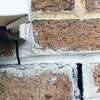 Failed crack repair showing old tuckpointing that cracked on a Eau Claire home.
