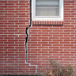 A foundation with a large crack that's wider at the top than on the bottom in Hibbing