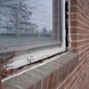 A gap in a window along the outer wall due to foundation settlement of a Eau Claire home.