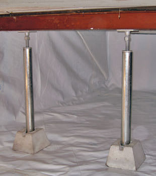 Crawl space jack posts installed in conjunction with a crawl space vapor barrier in Elk River