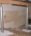 A system of crawl space support posts adding structural support to a crawl space in Maple Grove