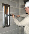 Tightening a wall anchor plate in Eau Claire, Minnesota and Wisconsin