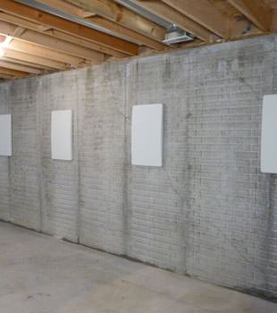 Wall anchor covers covering a foundation wall repair system in Duluth