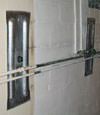 Foundation wall anchor plates installed in a basement in Duluth
