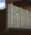 I-beam foundation wall supports installed in a Hibbing basement.
