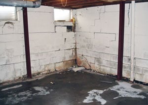 A failed, rusty i-beam foundation wall system installed in Solon SPrings.