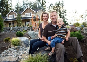 A happy family outside a home with a repaired foundation in Maple Grove