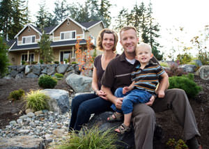 A happy family outside a home with a repaired foundation in Bemidji