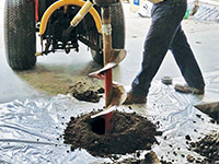 Digging the hole used for wall anchor installation in Duluth.