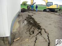 A foundation wall showing severe damage from bowing and buckling in Eau Claire