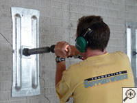 Mounting the steel wall plate for foundation wall repair and straightening in Hibbing.