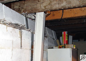 A failing foundation wall and i-beam support in a Duluth home