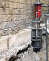 A completed installation of foundation push piers lifting a foundation