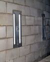 an inside view of foundation wall anchors installed 