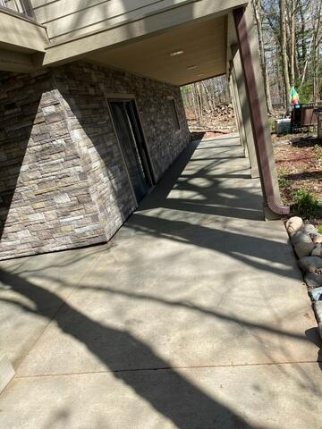 Polished and sealed back porch concrete area in Cumberland, WI after PolyLevel and SealantPro installation.
