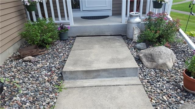 Concrete walkway with shifted slab and step before PolyLevel repair in McGregor MN
