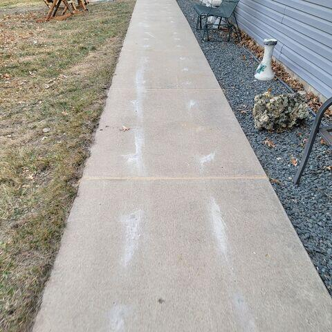 Leveled and restored exterior concrete sidewalk in Andover, MN after high-density PolyLevel foam lifting.