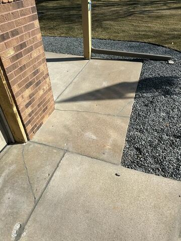 Exterior concrete walkway sections neatly aligned after polyurethane foam lifting in Blaine, MN.