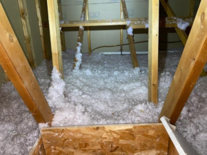 Drafty attic before insulation upgrade in Hudson WI