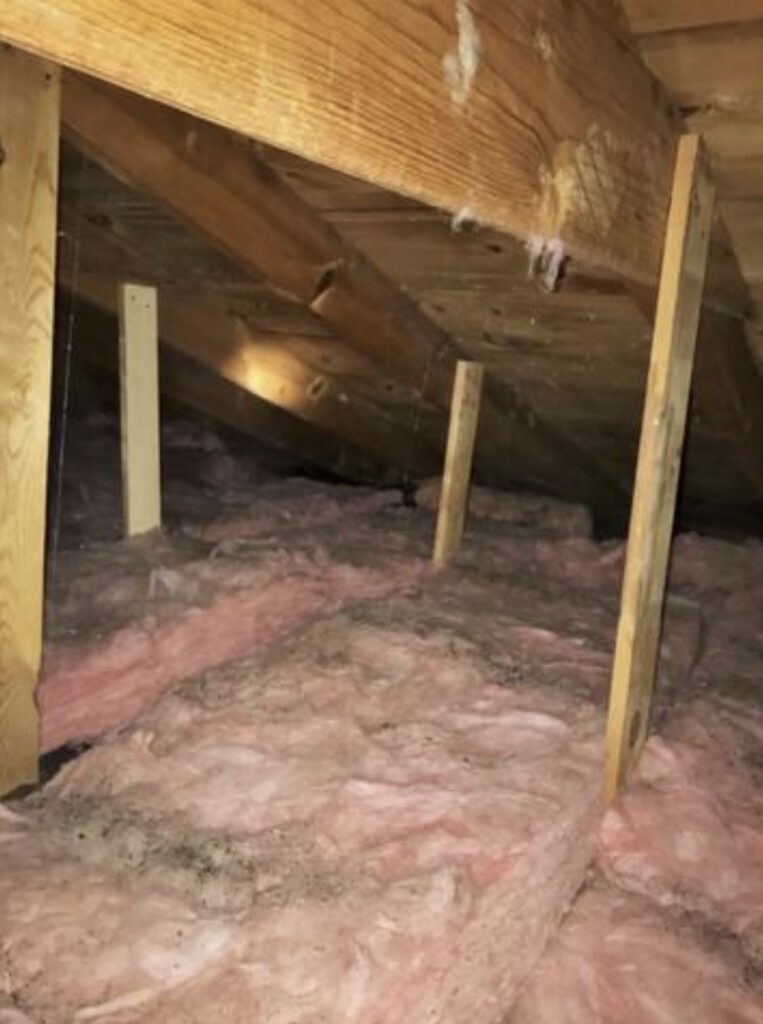Old attic insulation before energy efficiency upgrades in Remer MN