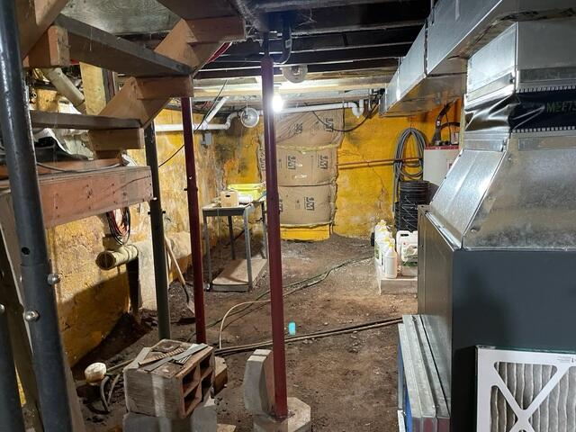 Clean, dry basement space after waterproofing installation in Wright MN