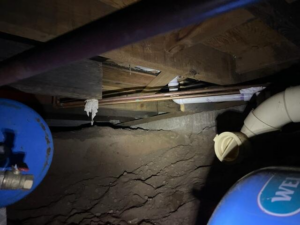 Difficult-to-access crawl space before repairs in Moose Lake, MN