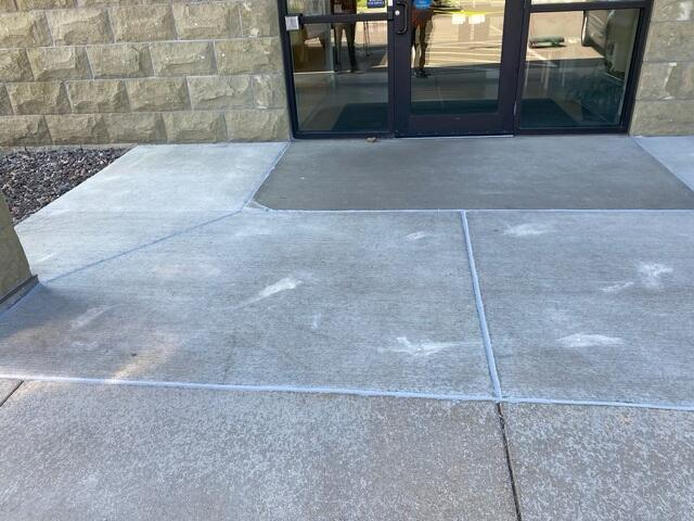 Perfectly leveled and stabilized commercial concrete entryway walkway after PolyLevel injection in Menomonie WI