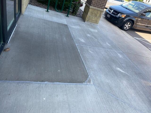Perfectly leveled and stabilized commercial concrete entryway walkway after PolyLevel injection in Menomonie WI