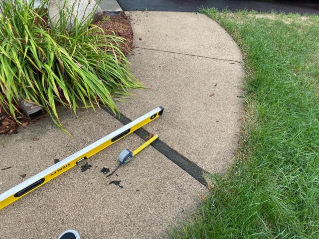concrete-driveway-settlement-minnesota-dbsrepair