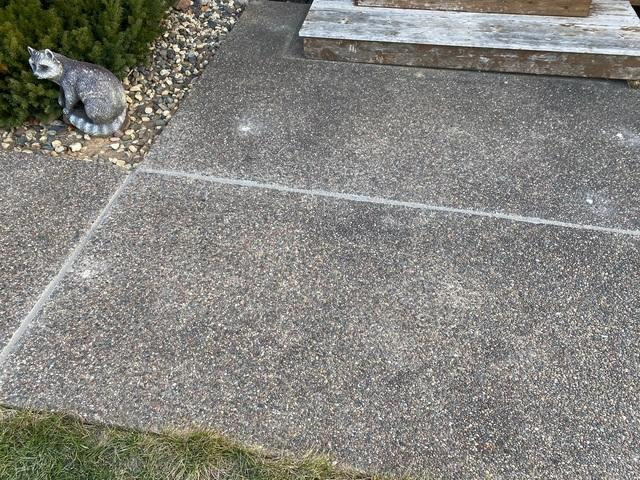 Perfectly leveled and clean concrete sidewalk slabs with even joints after PolyLevel foam repair in Amery, WI.