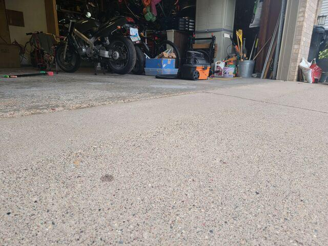 Clean and perfectly leveled concrete garage floor apron after concrete repair in Andover, MN.