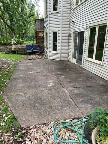 Perfectly leveled concrete patio section outside a home back door after PolyLevel repair in Anoka, MN.
