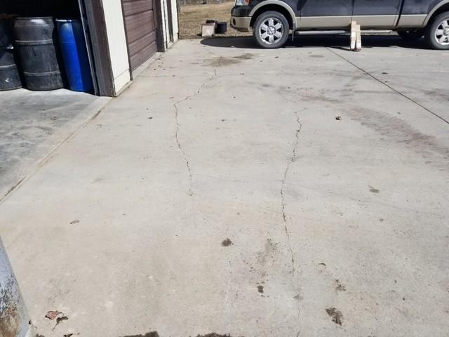 Cracked and uneven concrete driveway before lifting repair in Blackduck MN