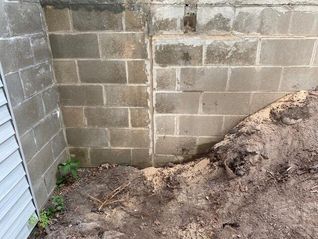 Excavated block foundation wall requiring pier stabilization in Hackensack MN