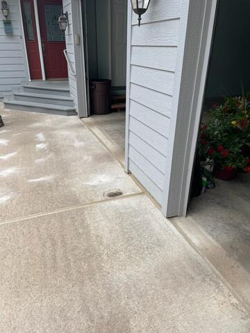 Clean, restored concrete driveway and entryway pathways with sealed joints after concrete leveling in Hayward, WI.